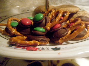 Holiday pretzel treats. A pretzel, a Hershey's Kiss, and an M&M.