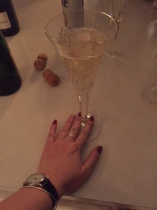 Celebrating! With bubbly and party nails.
